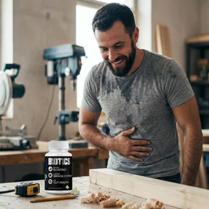 Hard-working blue-collar worker taking a daily probiotic supplement to support gut health and energy through long shifts