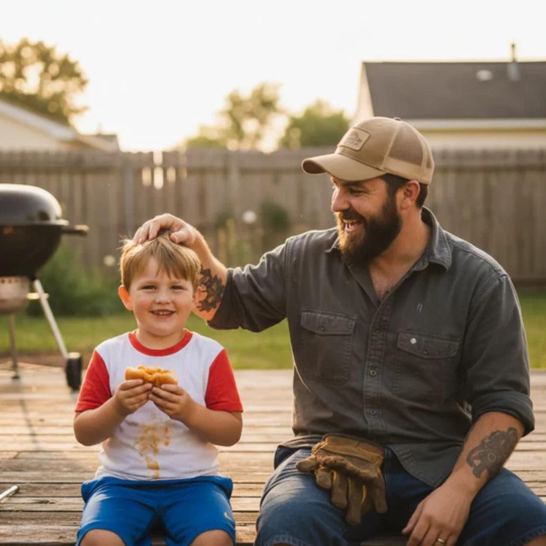 Hard-working father spending time with his young son in the backyard after a long workday.