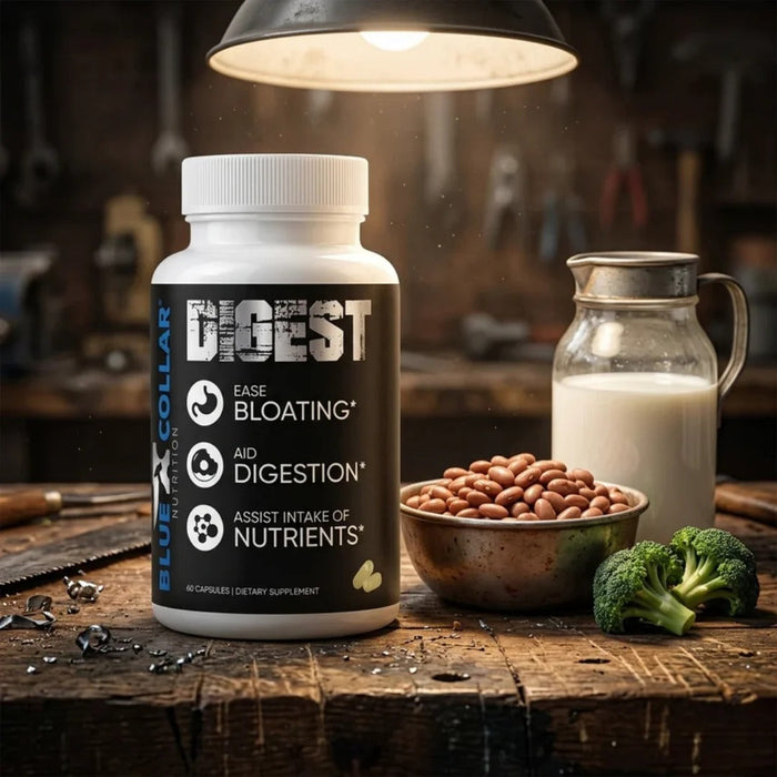 Blue Collar Nutrition Digest supplement on a workbench beside milk, beans, and broccoli for digestive support.
