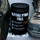 Before Work Fuel powdered energy drink next to work boots and field gear, built for tradesmen and physical workers
