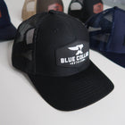 Black cap with 'Blue Collar' logo on a white background